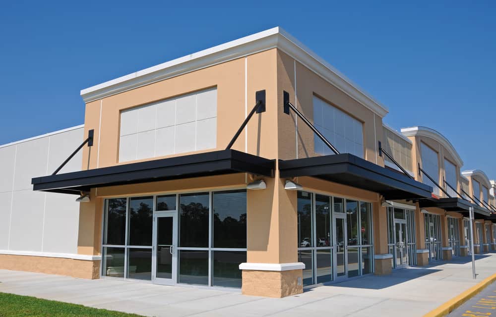 exterior of commercial storefront under construction.