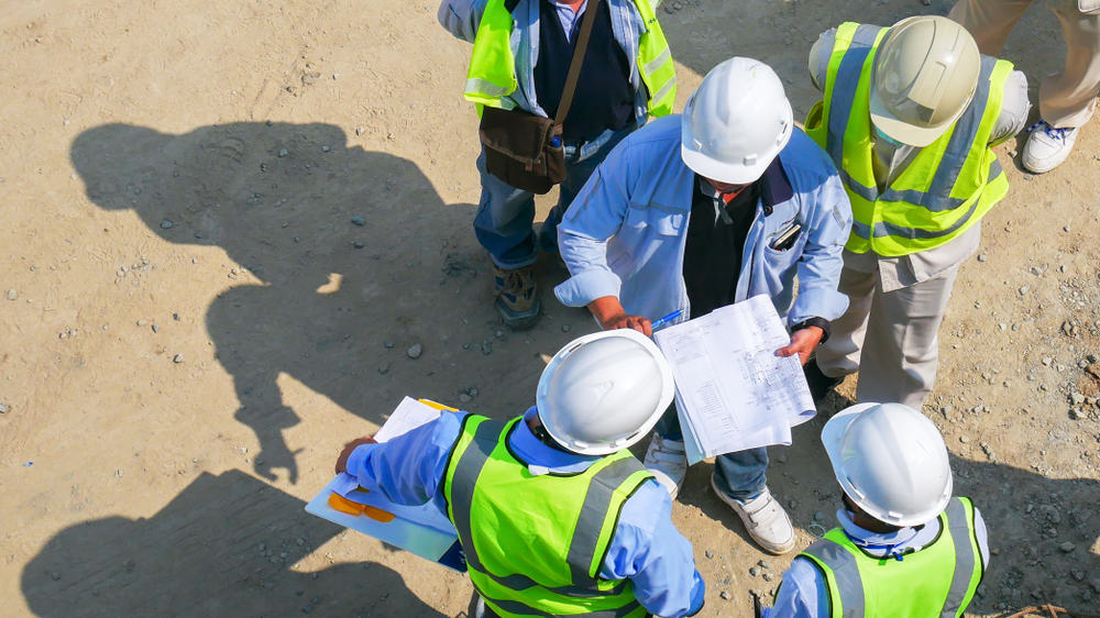aerial view of contractors discussing together